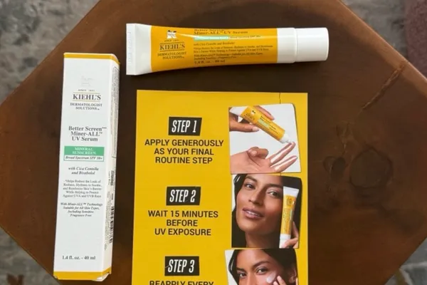 Kiehl's Better Screen Miner-ALL UV Serum box and tube next to the brand's three-step application card