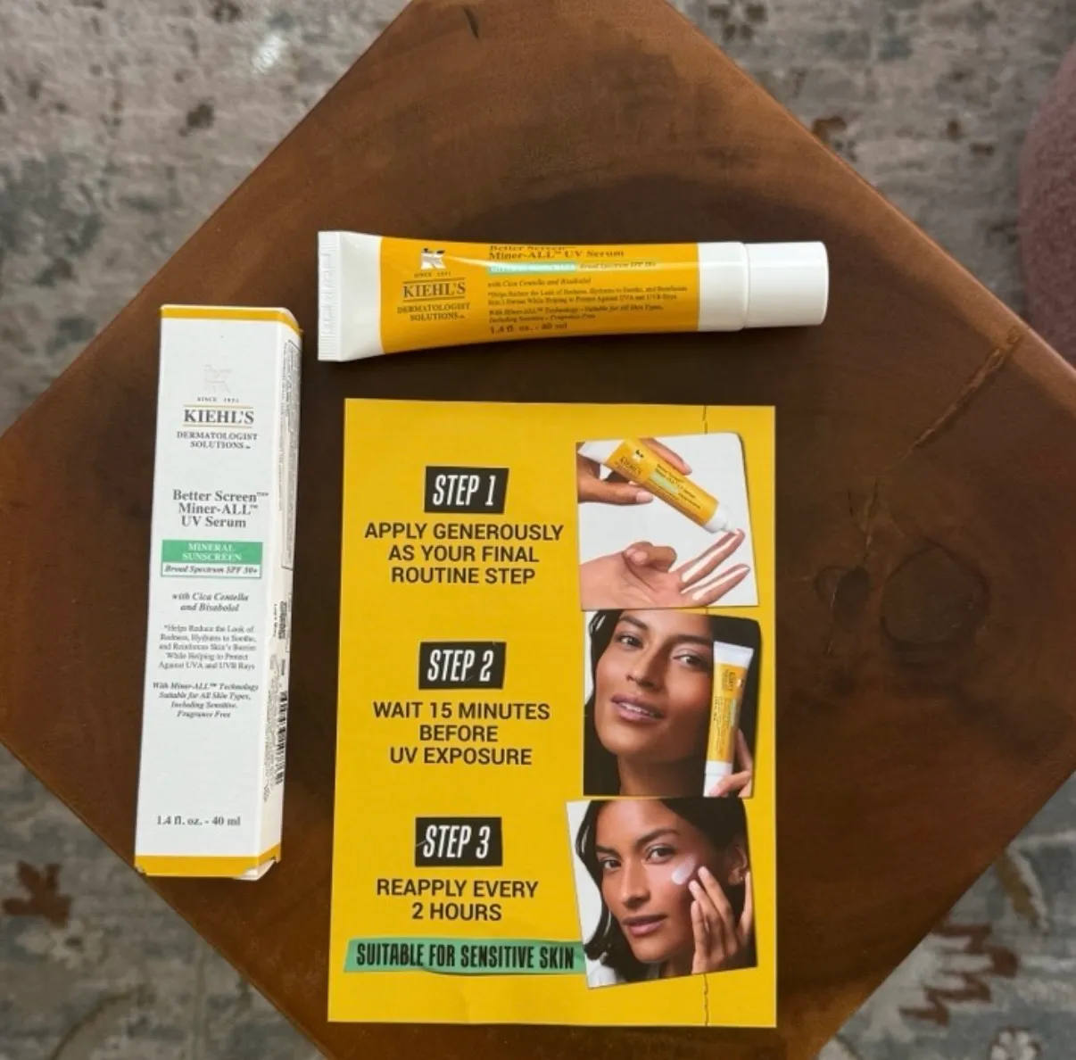 Kiehl's Better Screen Miner-ALL UV Serum box and tube next to the brand's three-step application card